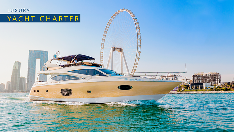 Tourists chartering a luxury yacht from Sky Walker Yachts slowly travelling on the waters near the Ain Dubai
